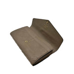 Load image into Gallery viewer, Louis Vuitton Turtledove Monogram Empreinte Leather Sarah Wallet (Pre-owned)
